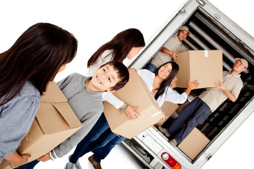Professional movers unloading furniture at a Dulwich property