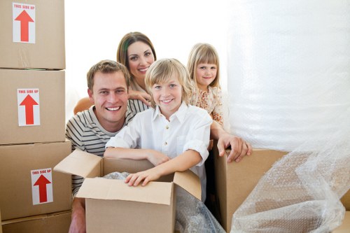 Professional movers handling furniture in a Dulwich property