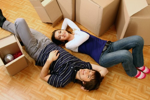 Packed boxes and removal equipment ready for a local move