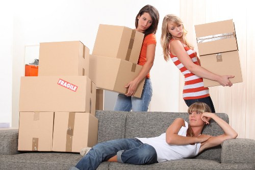Packed office furniture and boxes ready for a business move in Dulwich